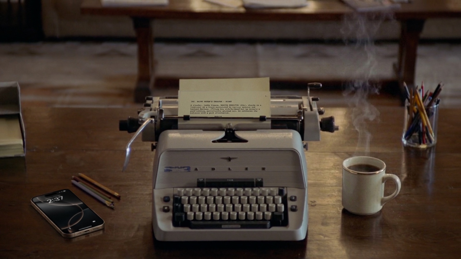A typewriter — the writing at the heart of the work.